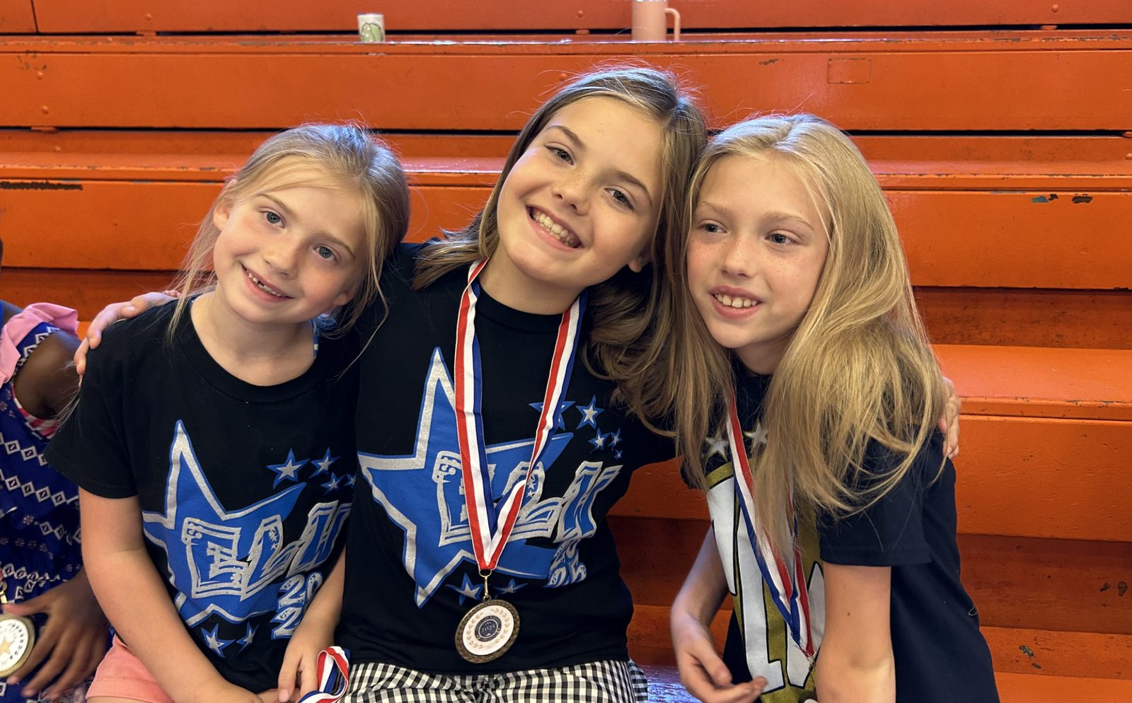 ELW campers wearing achievement medals